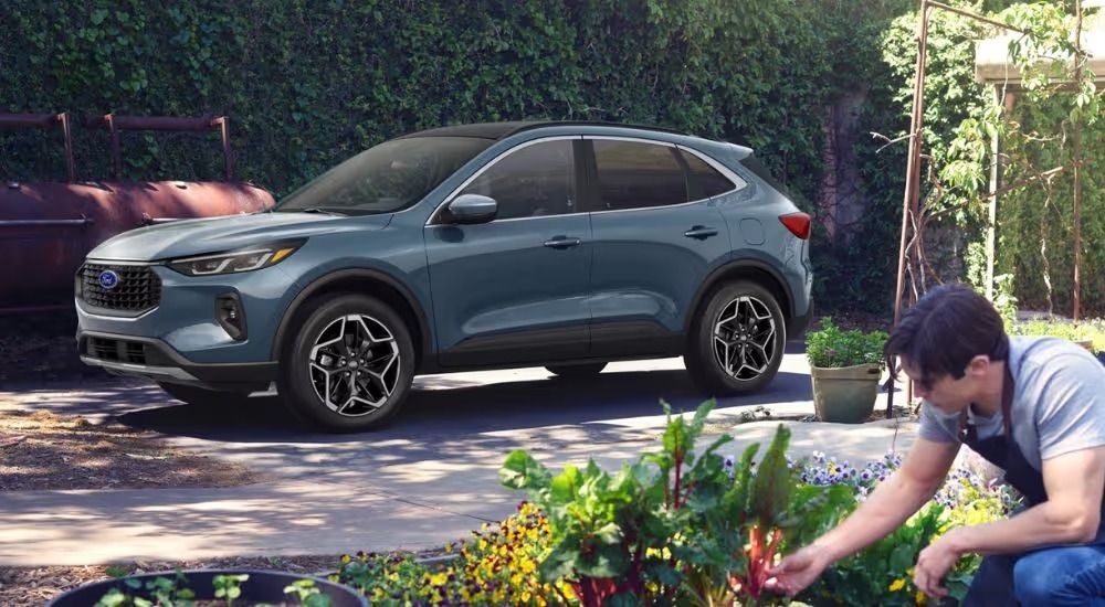 Blue 2026 Ford Escape parked in a driveway.