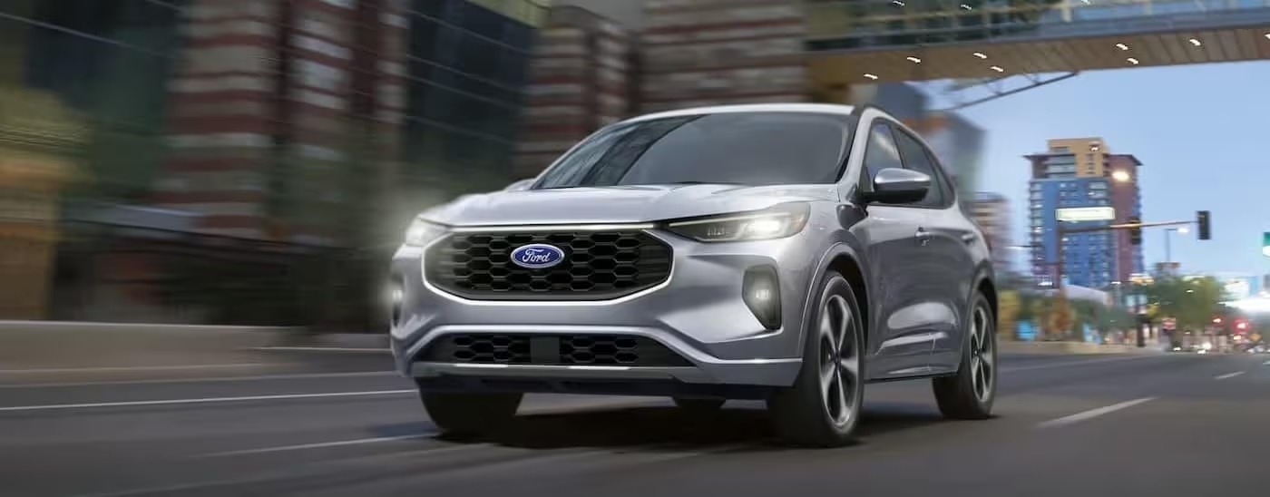 A silver 2024 Ford Escape is shown driving to a Ford dealer near Alpharetta.