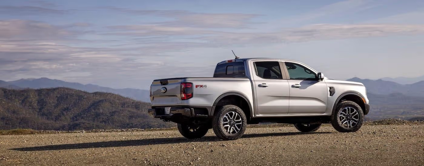 A silver 2024 Ford Ranger Lariat is shown from the side.