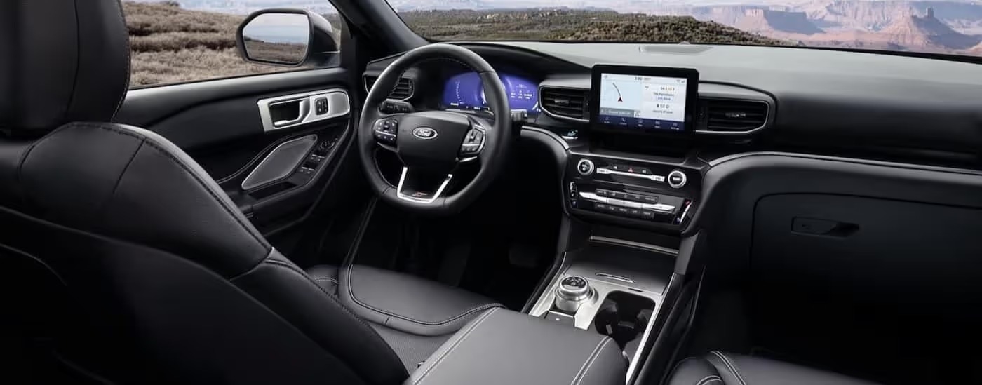 The black interior and dash in a 2024 Ford Explorer XLT is shown.