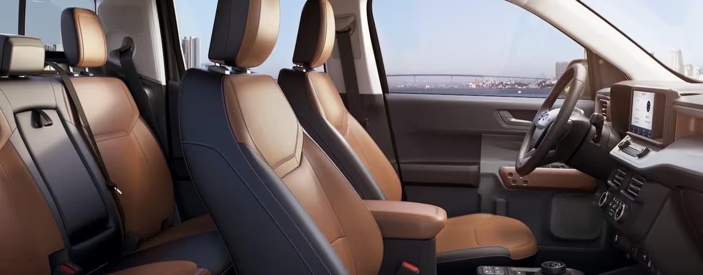 The black and brown interior and dash in a 2024 Ford Maverick Lariat is shown.