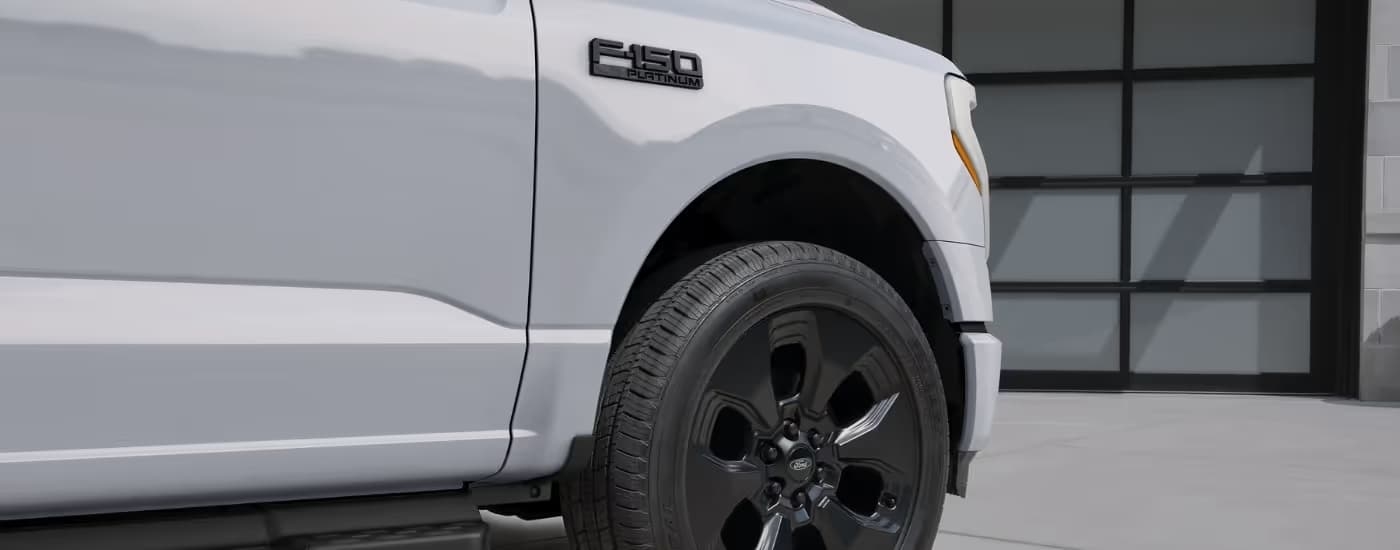 Exterior details on a white 2025 Ford F-150 Lightning Platinum.