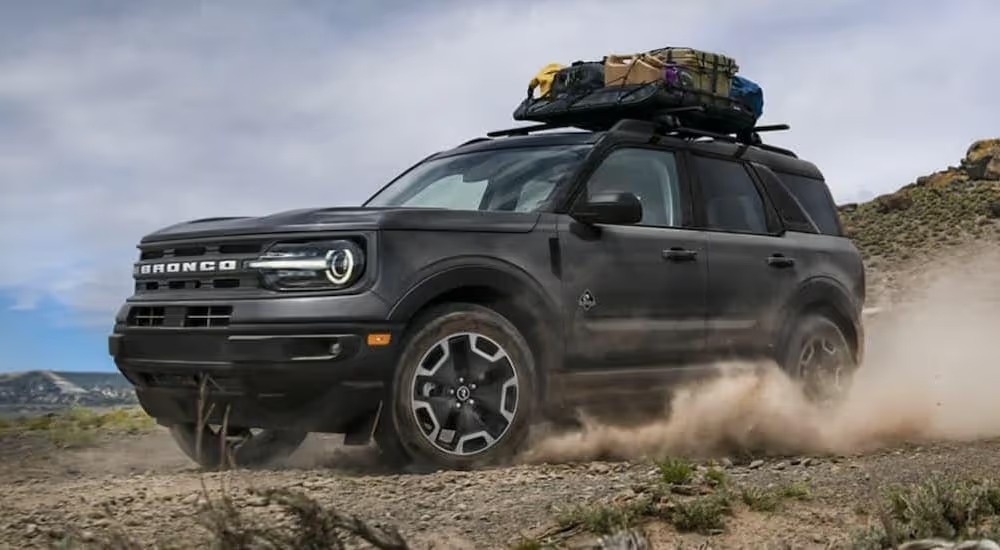 A black 2021 Ford Bronco Sport is shown from the front at an angle while off-road.