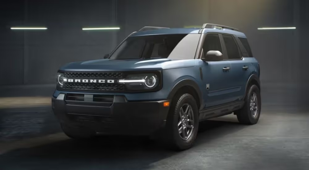 Blue 2026 Ford Bronco SPort parked against a concrete background