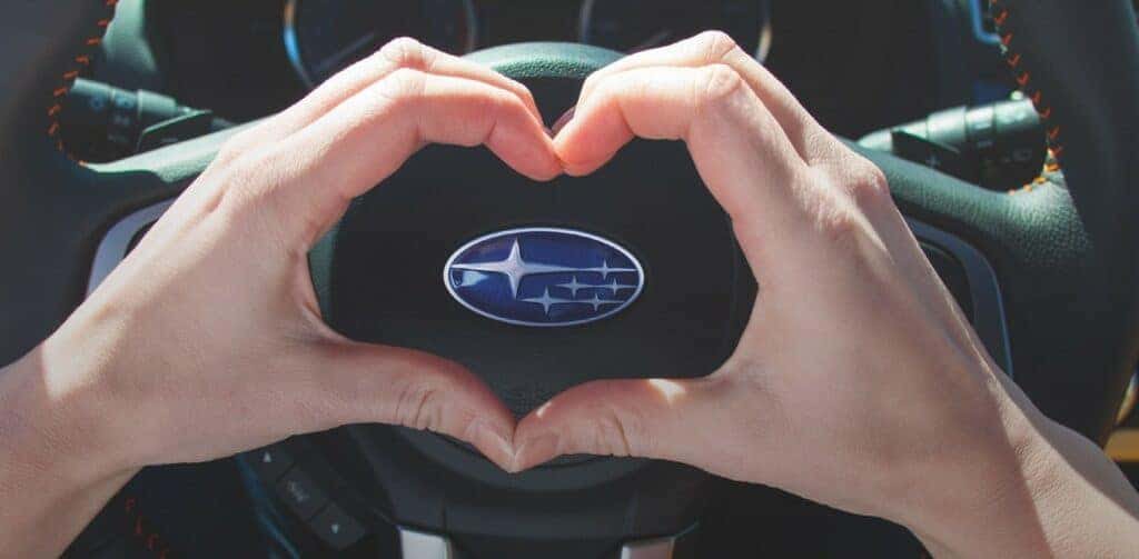 Subaru Love Promise - Heart Hands Around the Subaru Logo