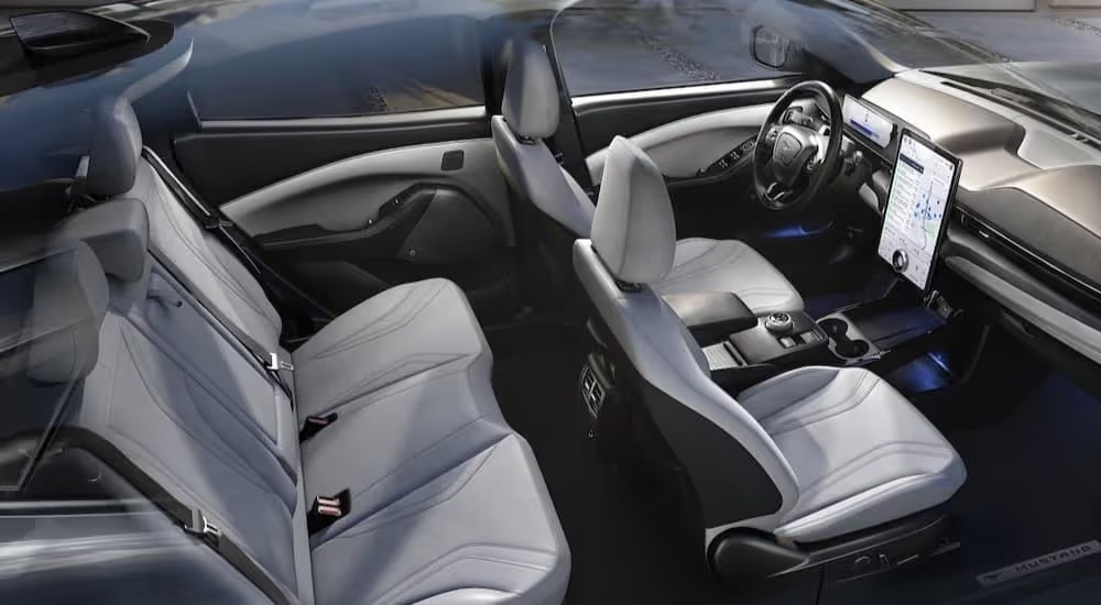 The black and white interior and dash in a 2024 Ford Mustang Mach-E is shown.
