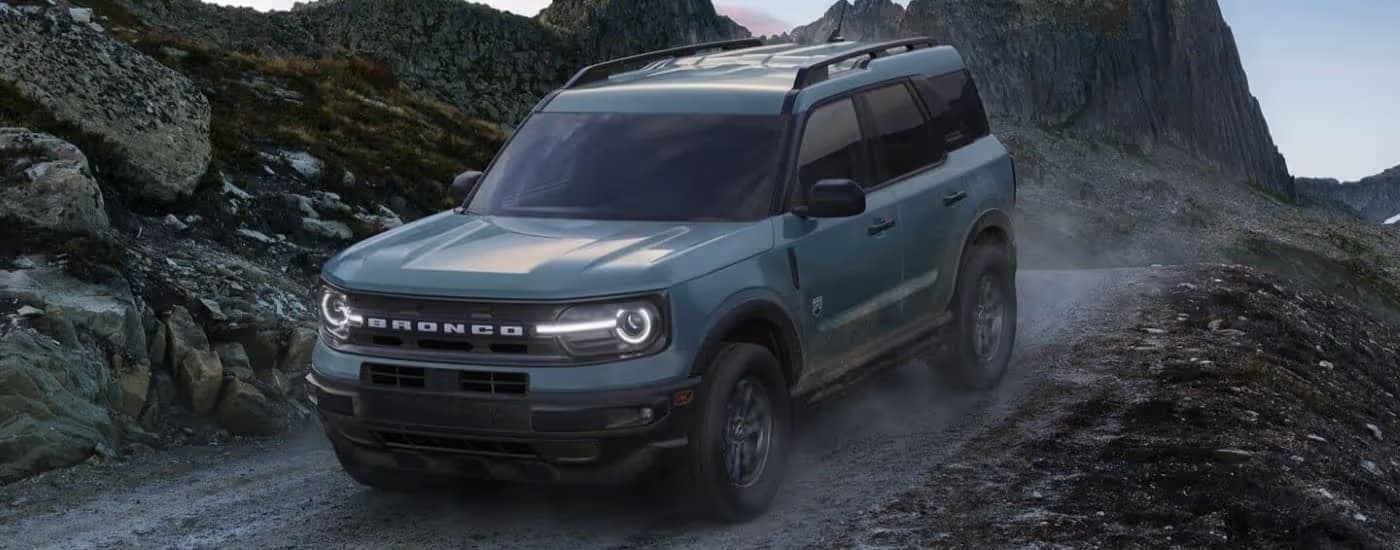 A blue 2024 Ford Bronco Sport off-roading.