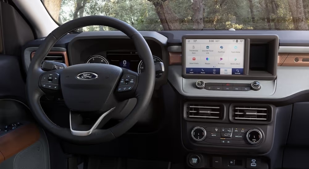 The black dashboard is shown in a 2025 Ford Maverick for sale.