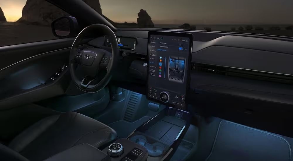 Black interior cabin and infotainment display on a 2024 Ford Mustang Mach-E.
