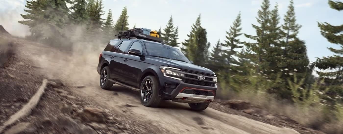 A black 2023 Ford Expedition off-roading.