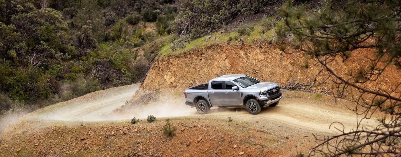 A silver 2024 Ford Ranger off-roading.