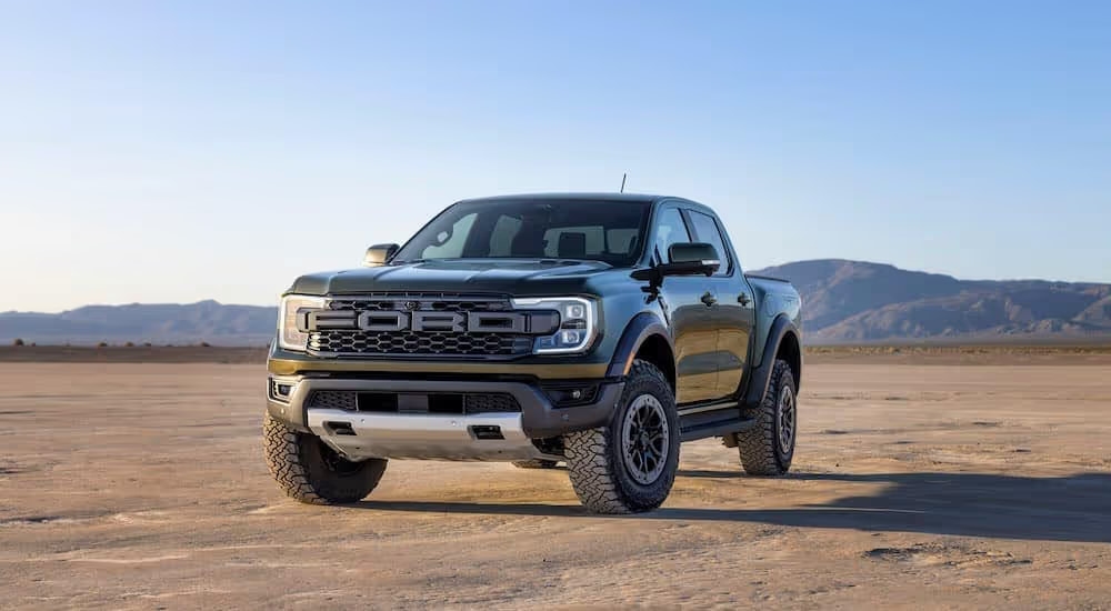 A green 2025 Ford Ranger Raptor is shown from the front at an angle after leaving a Ford dealer near Smyrna.