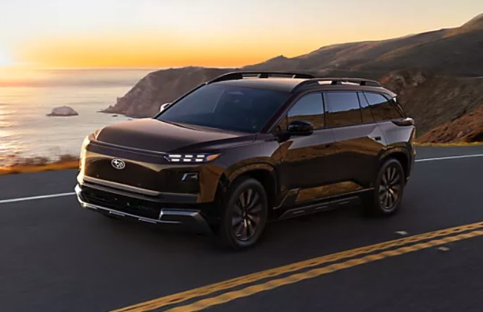 A 2026 Subaru Solterra EV on a coastal highway, available with financing in Prescott, AZ at Findlay Subaru Prescott