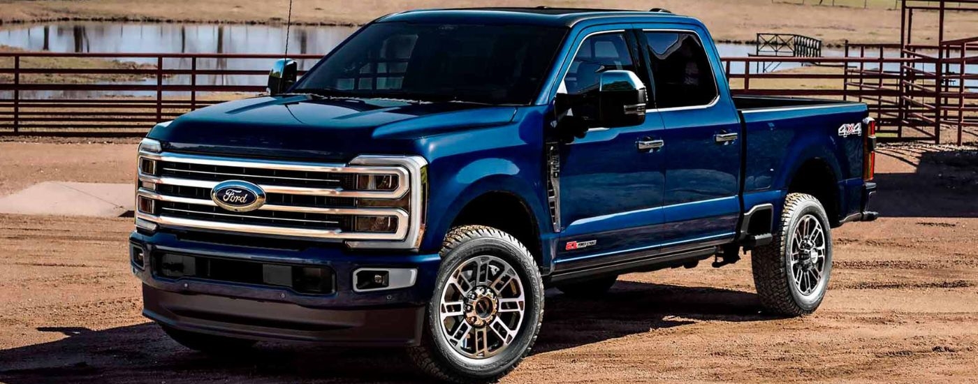 Blue 2026 Ford Super Duty parked on a ranch.