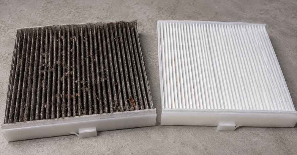 Toyota-trained technician inspecting a cabin air filter at Toyota of Downtown Chicago