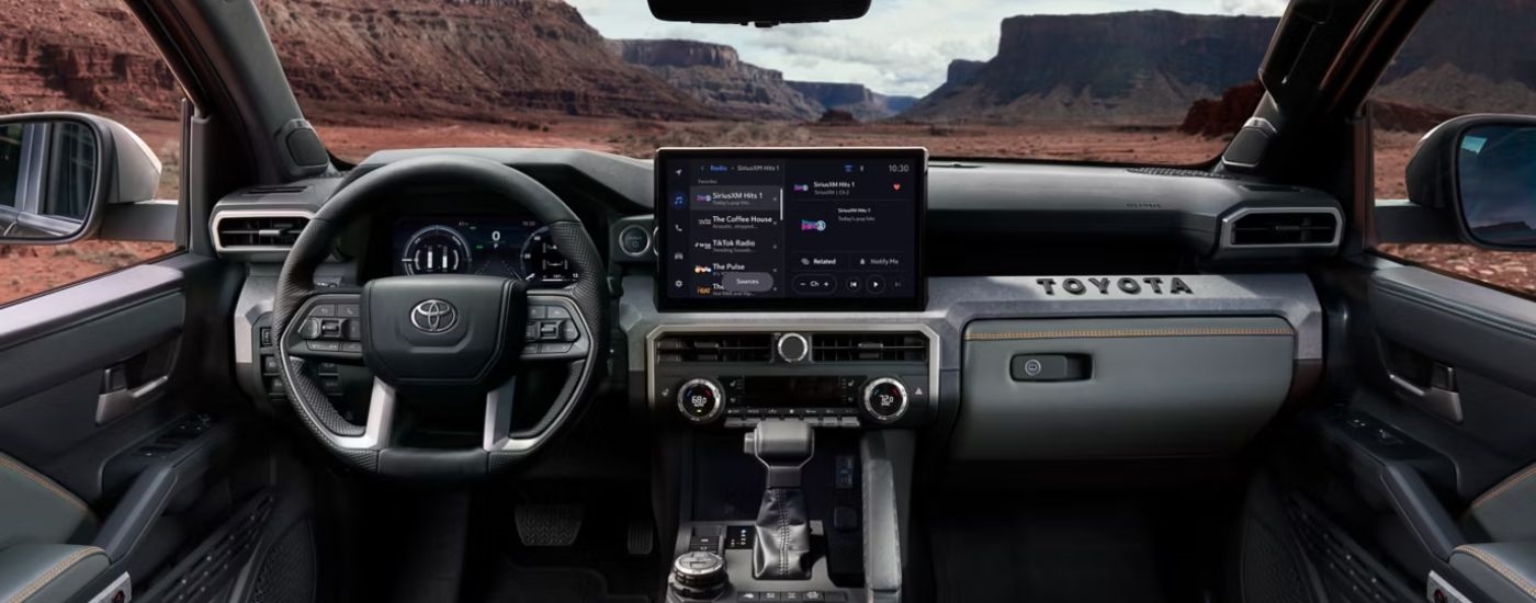 Infotainment display and steering wheel on a 2026 Toyota Tacoma.