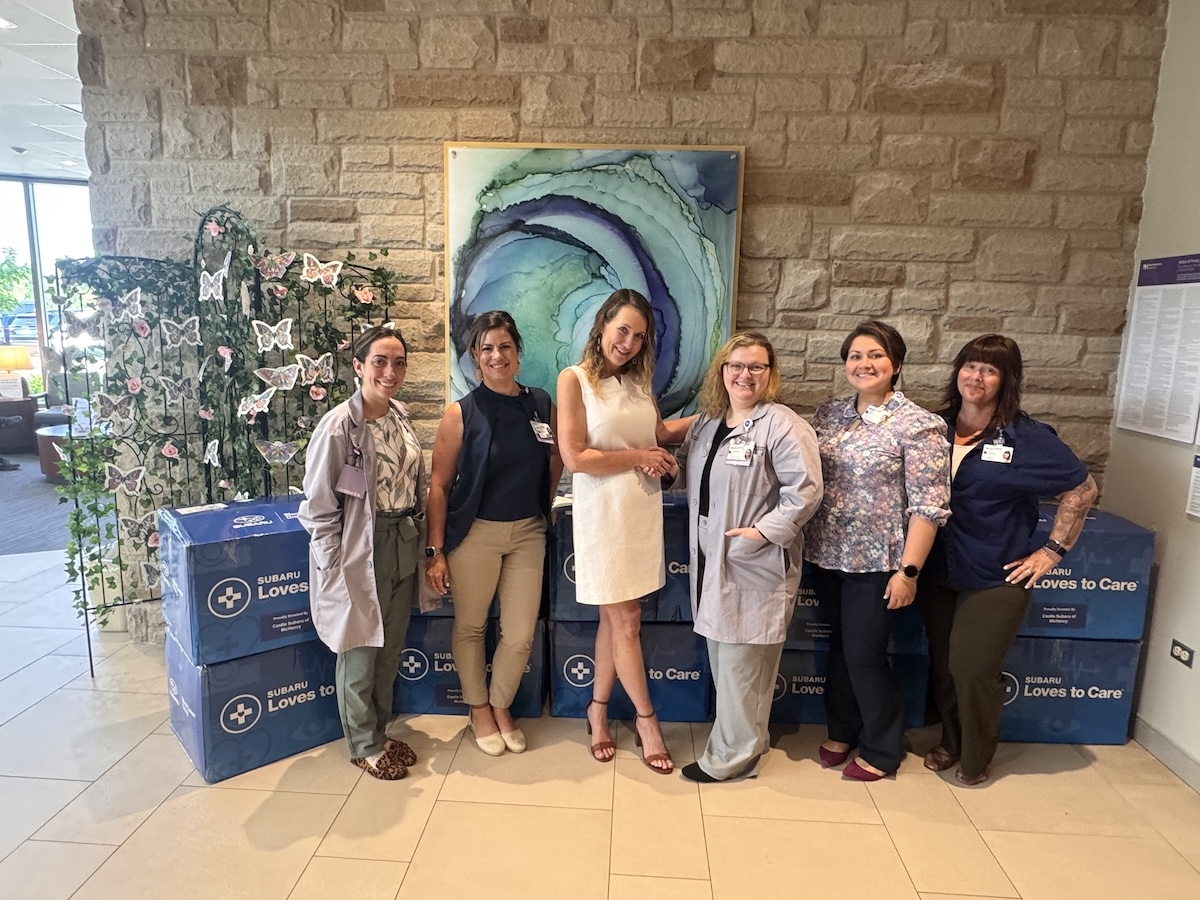 Castle Subaru McHenry presents Subaru Loves to Care blankets to Northwestern Medicine McHenry Hospital staff