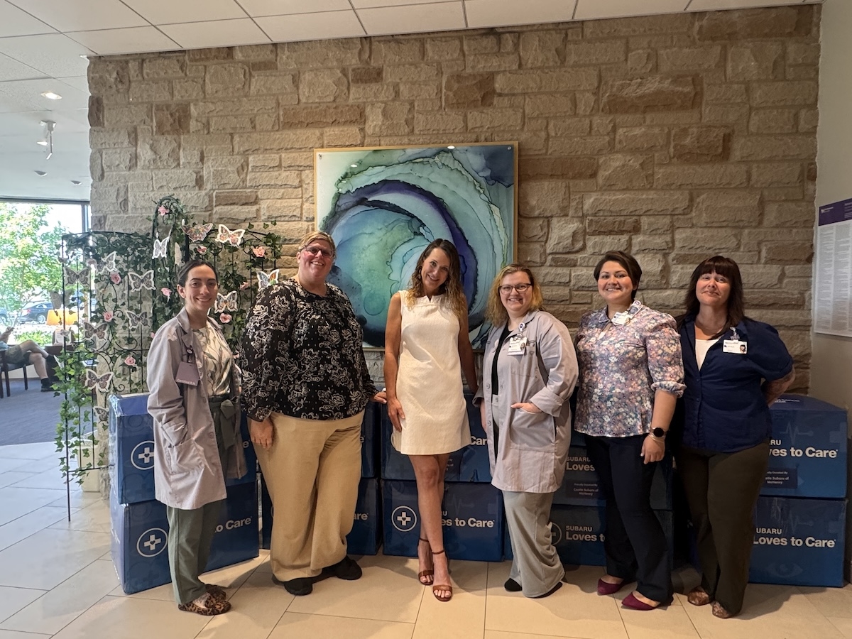 Castle Subaru McHenry and Northwestern Medicine staff with donated Subaru Loves to Care blankets