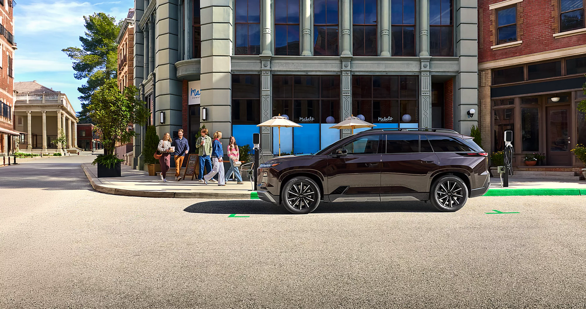 The 2027 Subaru Getaway charging in a city