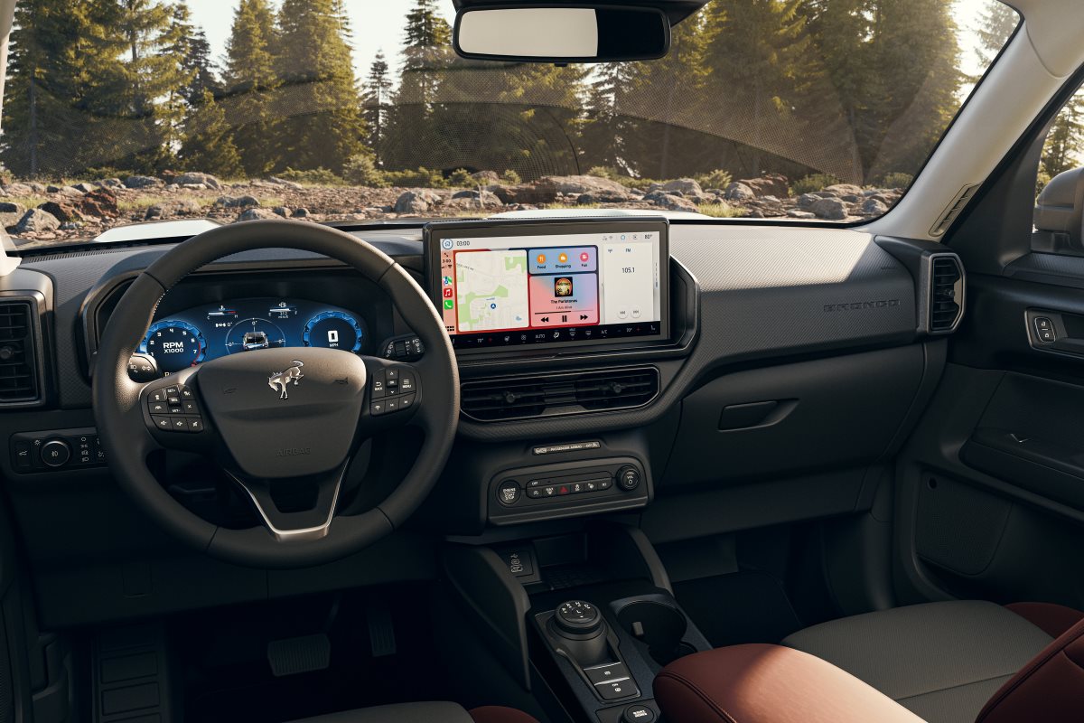 2025 Ford Bronco Sport interior featuring a touchscreen infotainment system, digital instrument cluster, multifunction steering wheel, and modern dashboard technology.