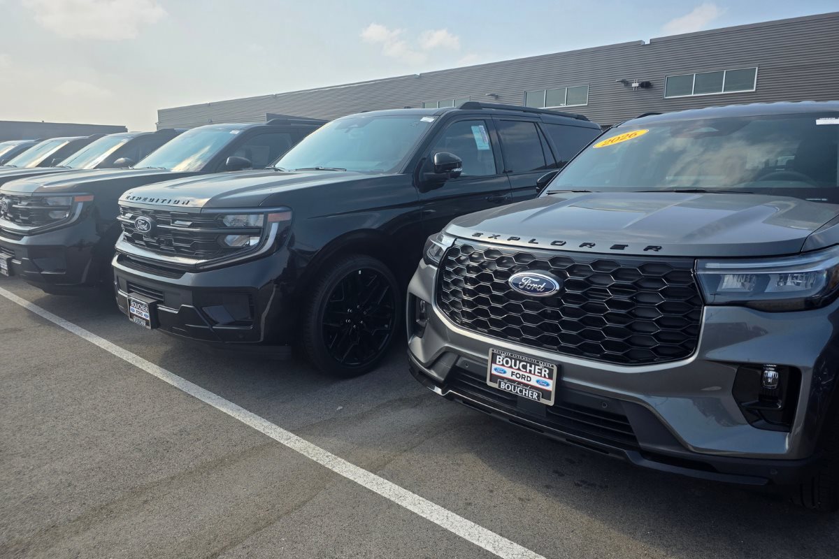 New Ford Explorer and Expedition SUVs displayed on the dealership lot at Gordie Boucher Ford of Kenosha.