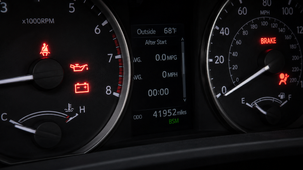 Toyota instrument cluster showing red warning light indicators