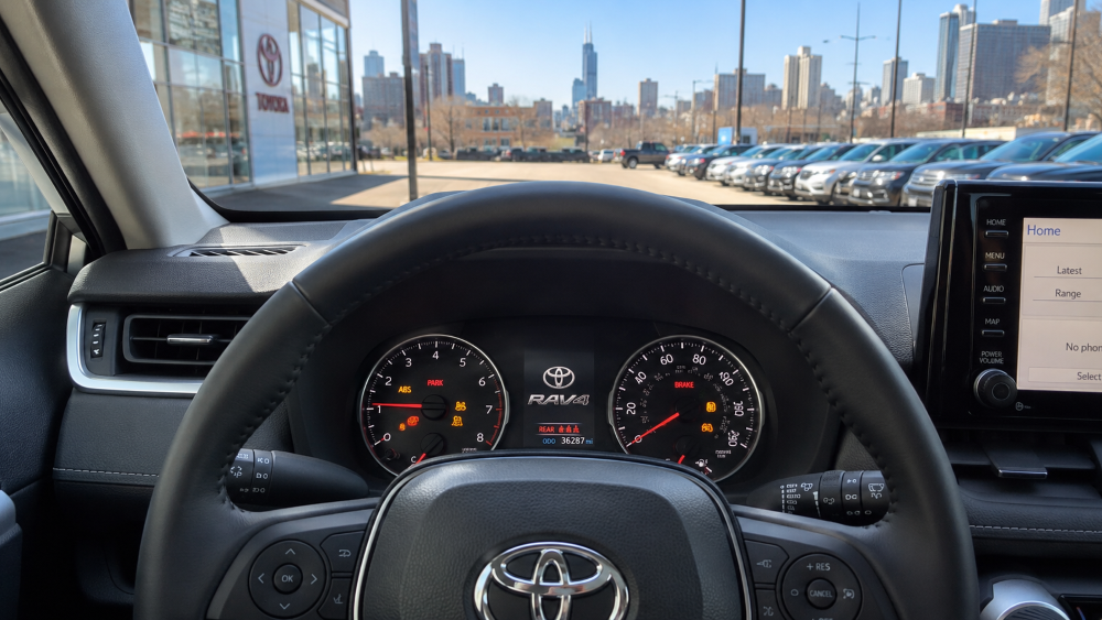 Toyota RAV4 instrument cluster showing multiple dashboard warning lights illuminated