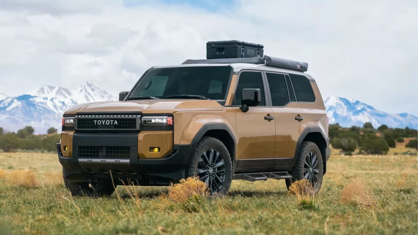 2027 Toyota Land Cruiser on a rugged mountain trail at golden hour