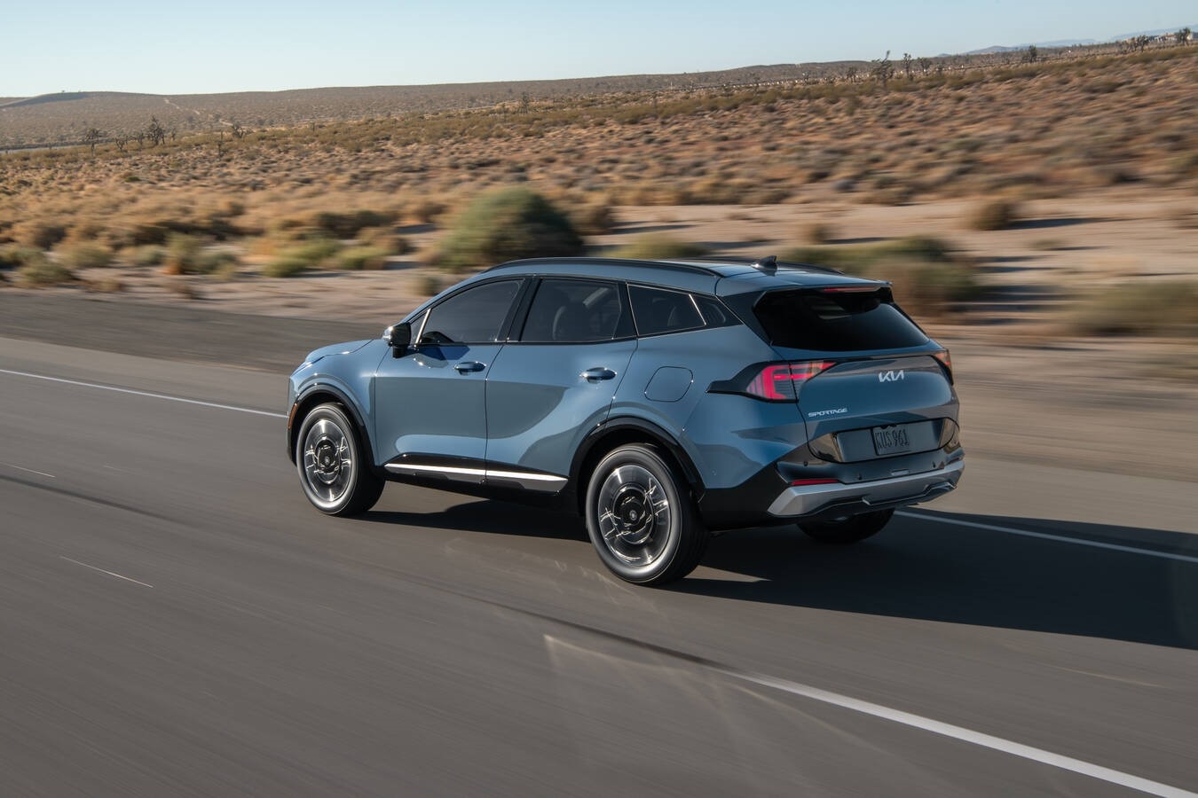 Kia Sportage Hybrid cargo area loaded with groceries and beach gear