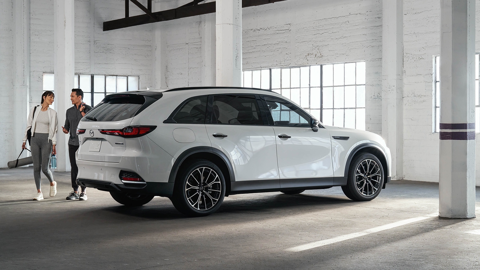 Patterson Autos team reviewing Mazda IIHS safety ratings with an Orange County shopper