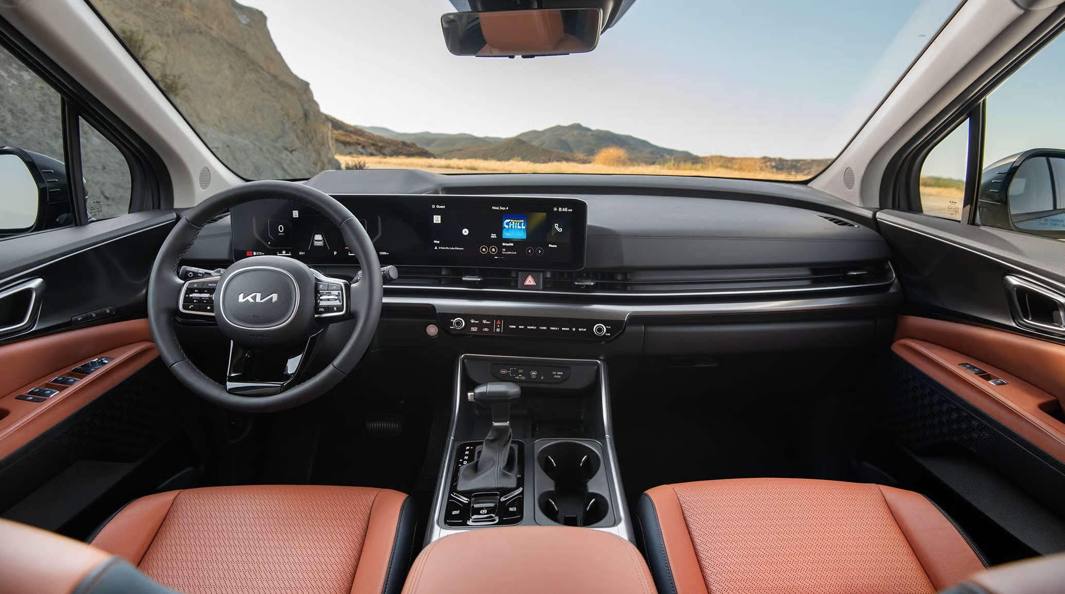 Kia Carnival interior with three rows of seating and premium cabin materials