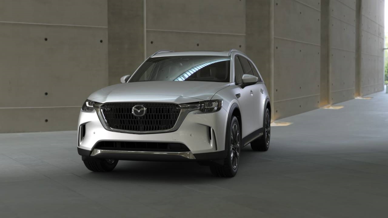 Family loading a Mazda CX-90 PHEV for a Southern California weekend trip