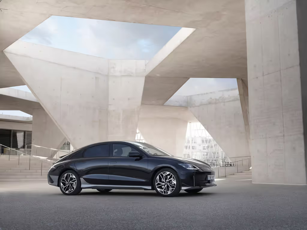 2023 Hyundai IONIQ 6 parked under modern architecture