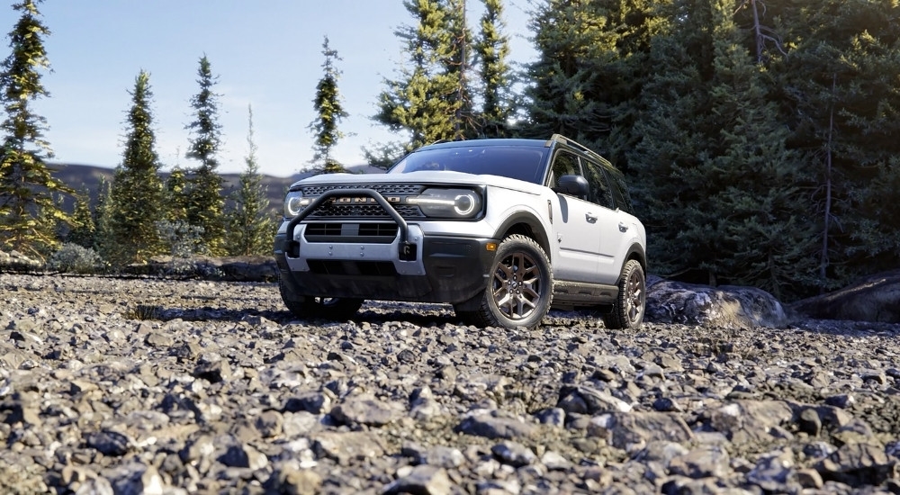 A white 2026 Ford Bronco Sport Big Bend Bronze Black Diamond parked on rocks.