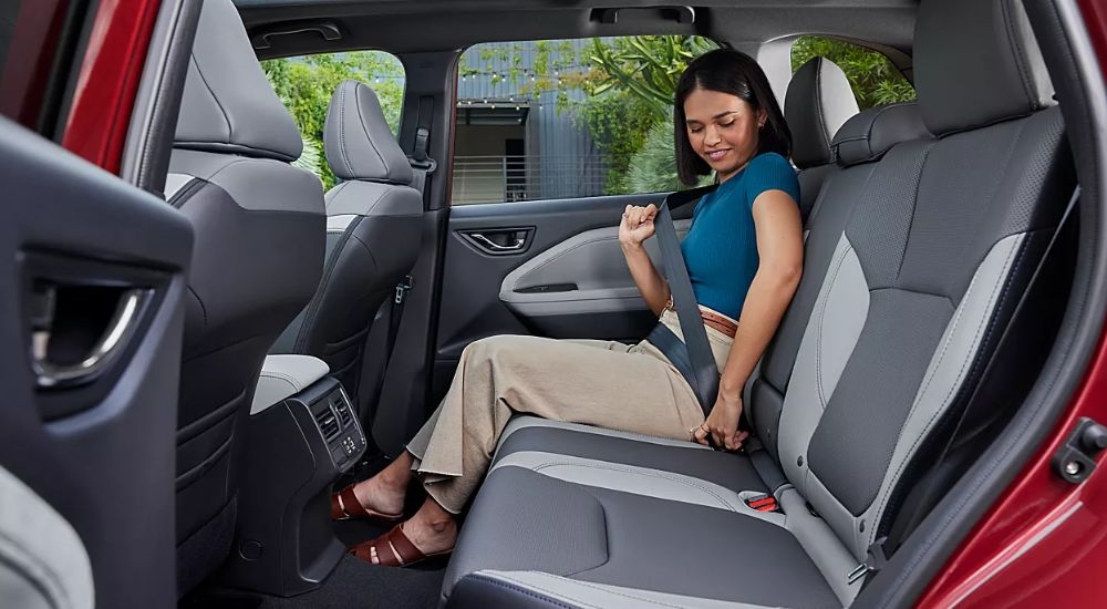 The spacious rear interior of a red 2026 Subaru Forester Limited.