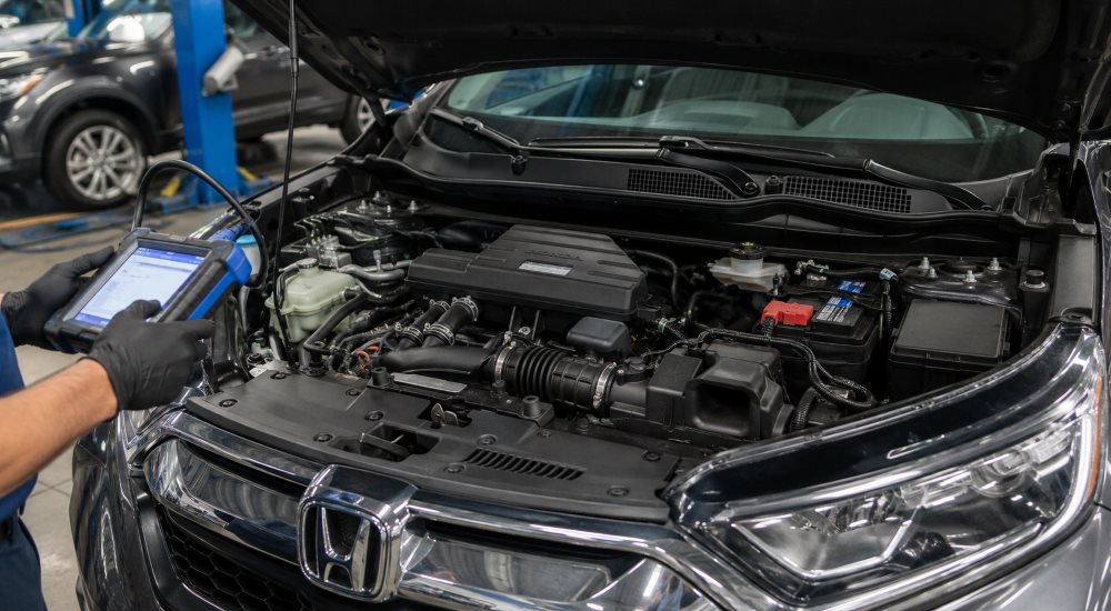 Honda CR-V 1.5L turbo engine bay during a check engine light diagnosis at Brickell Honda