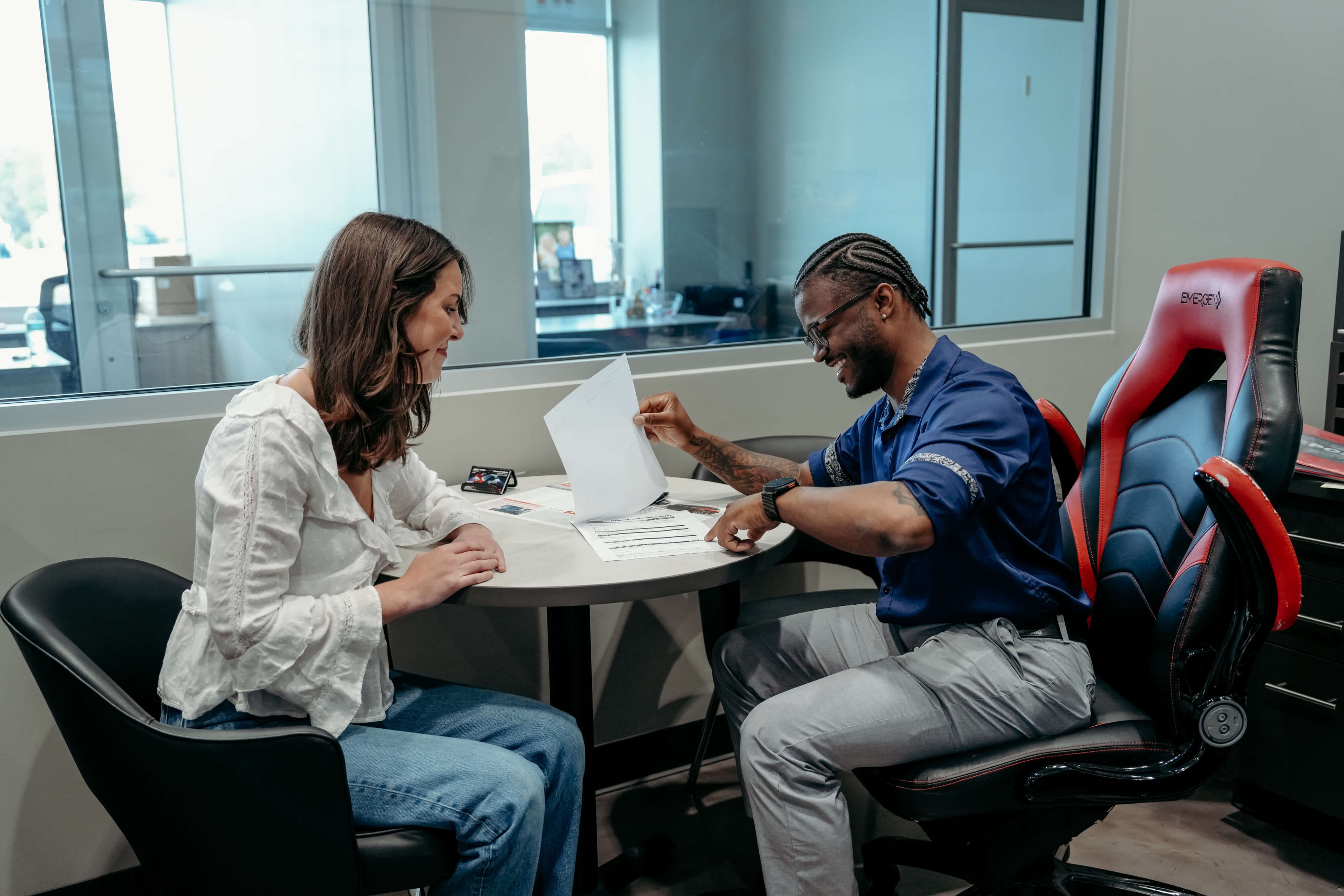 Customer reviewing finance paperwork with a Toyota of Gallatin team member