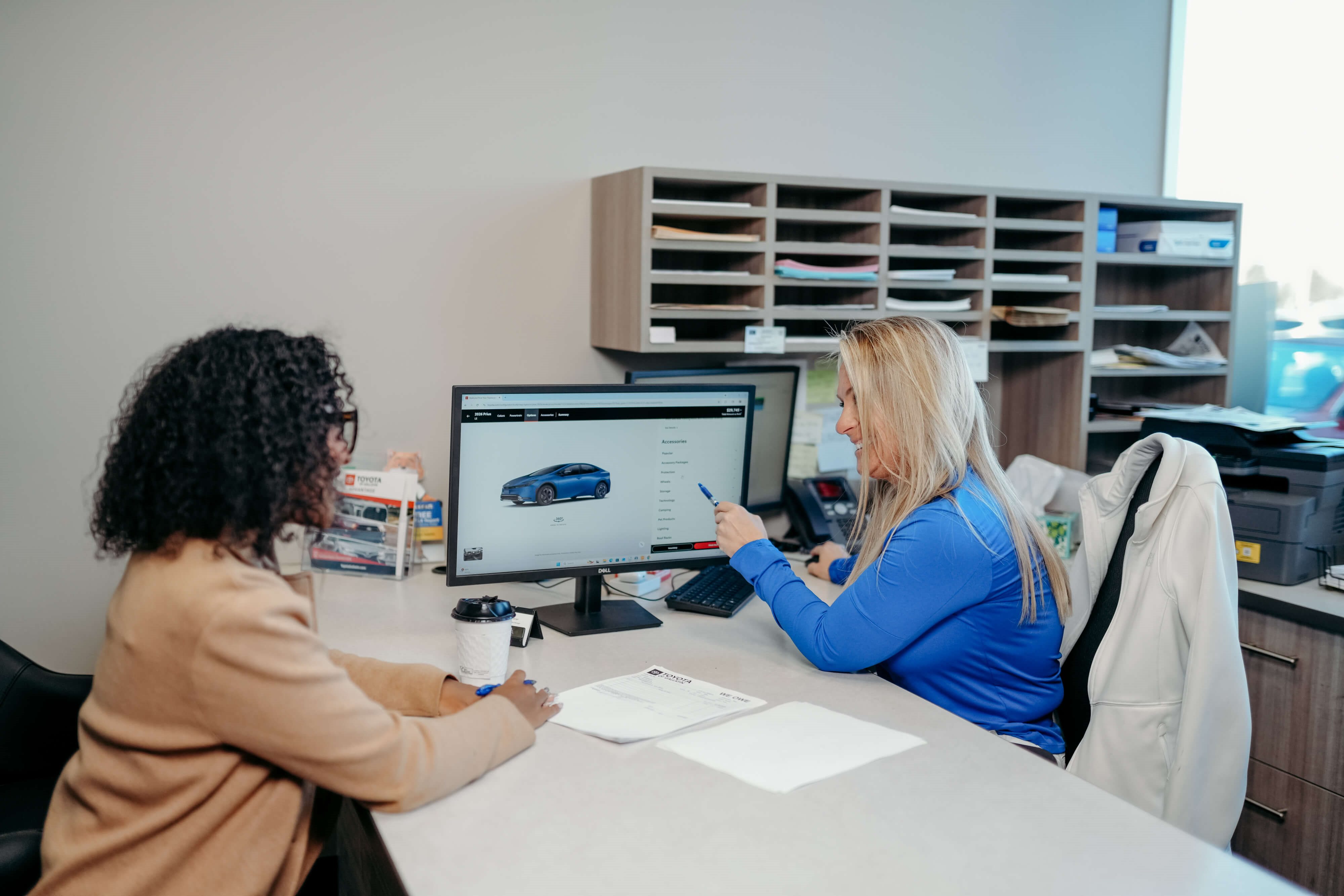 Toyota of Gallatin finance team member reviewing vehicle options with a customer