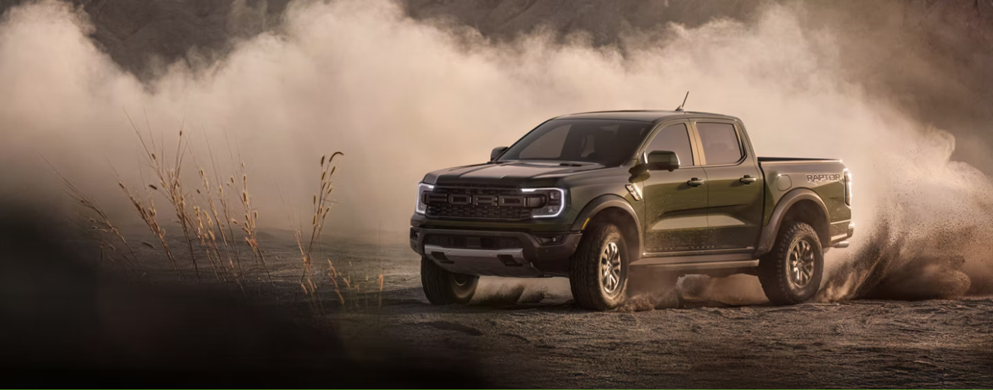 Green 2026 Ford Ranger Raptor drifting off-road