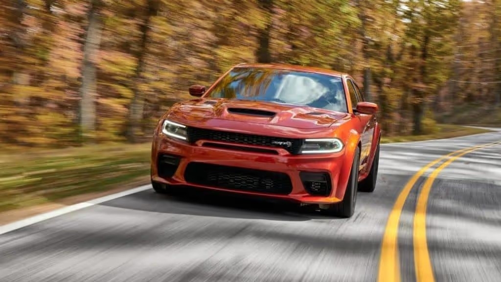 2022 dodge charger in action shot of the vehicle driving on the road