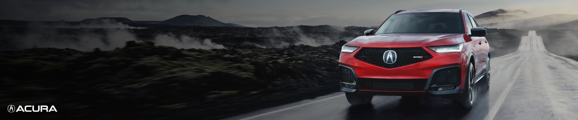 Front low angle banner view of a red Acura MDX Type S driving at wet mountain pass road.