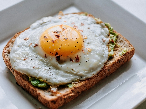 avacodo toast on a plate at a brunch restaurant in Mission Vijeo, CA