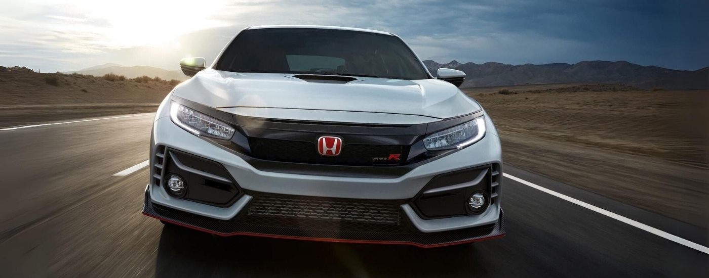 A white 2021 Honda Civic Type R shown driving head-on.