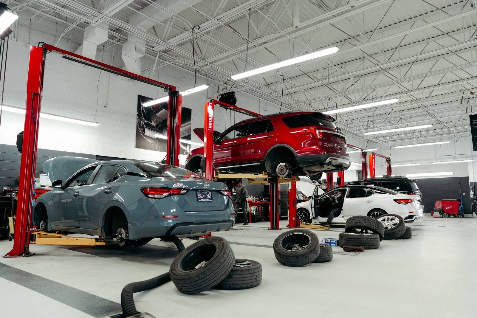 Toyota of Gallatin technicians inspecting a vehicle and its tires