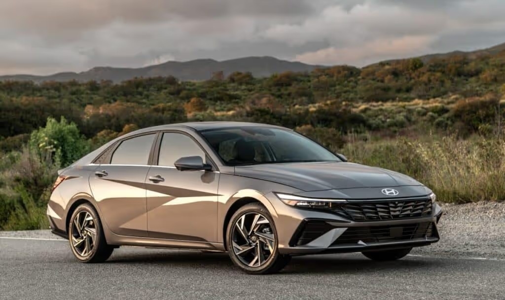 2025 Hyundai Elantra parked in front of lush rolling hills