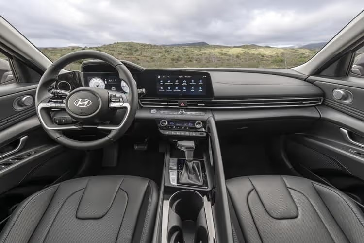 The interior of a 2025 Hyundai Elantra featuring modern design, comfortable seating, and advanced technology features.