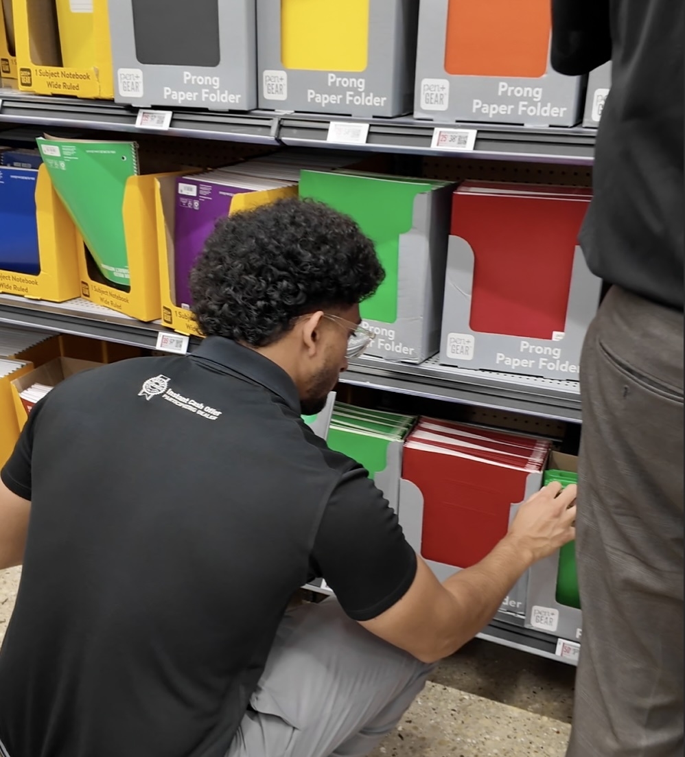 Castle Volkswagen of Schaumburg team helping pack school supplies onto the bus