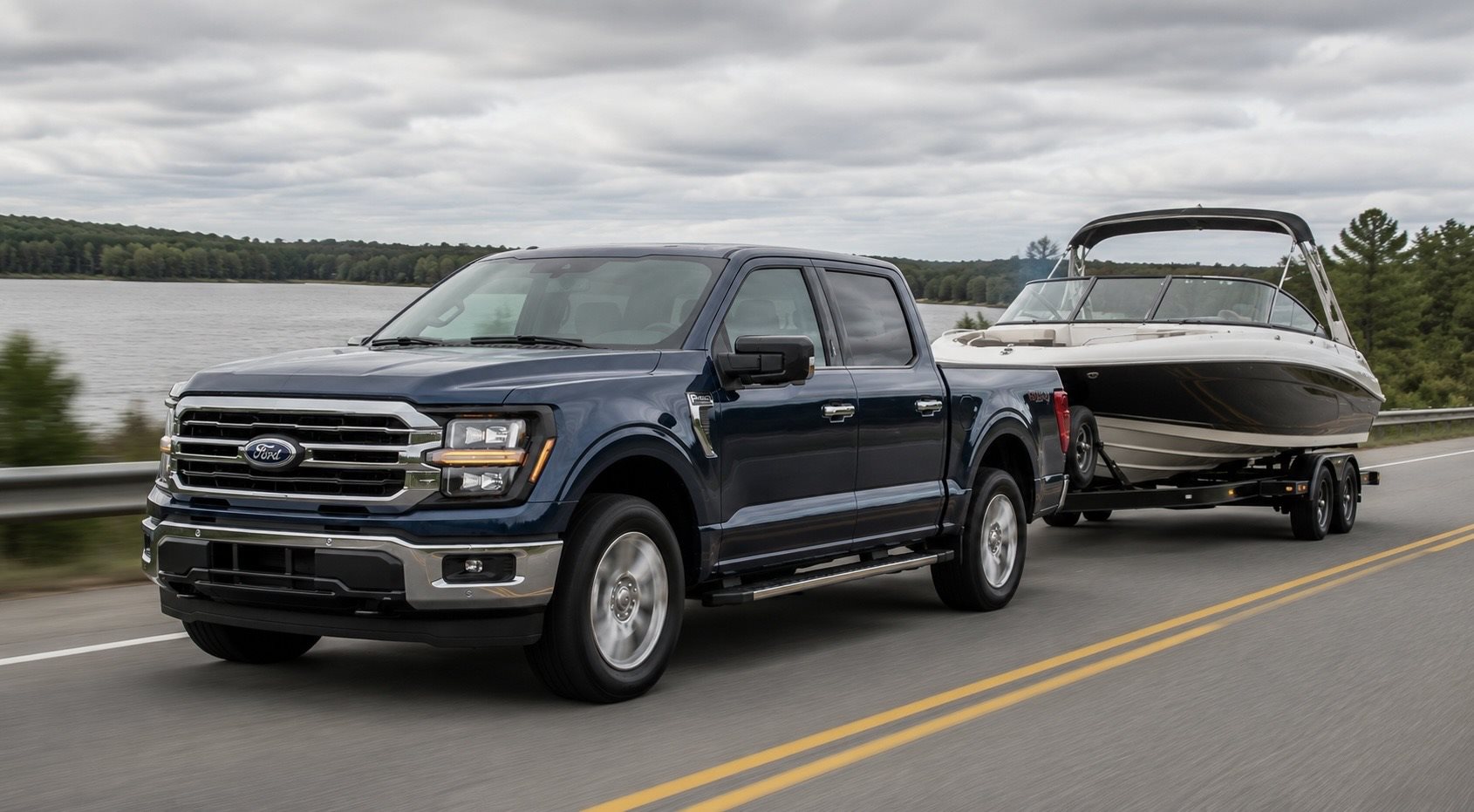 2026 Ford F-150 towing a boat trailer on a highway