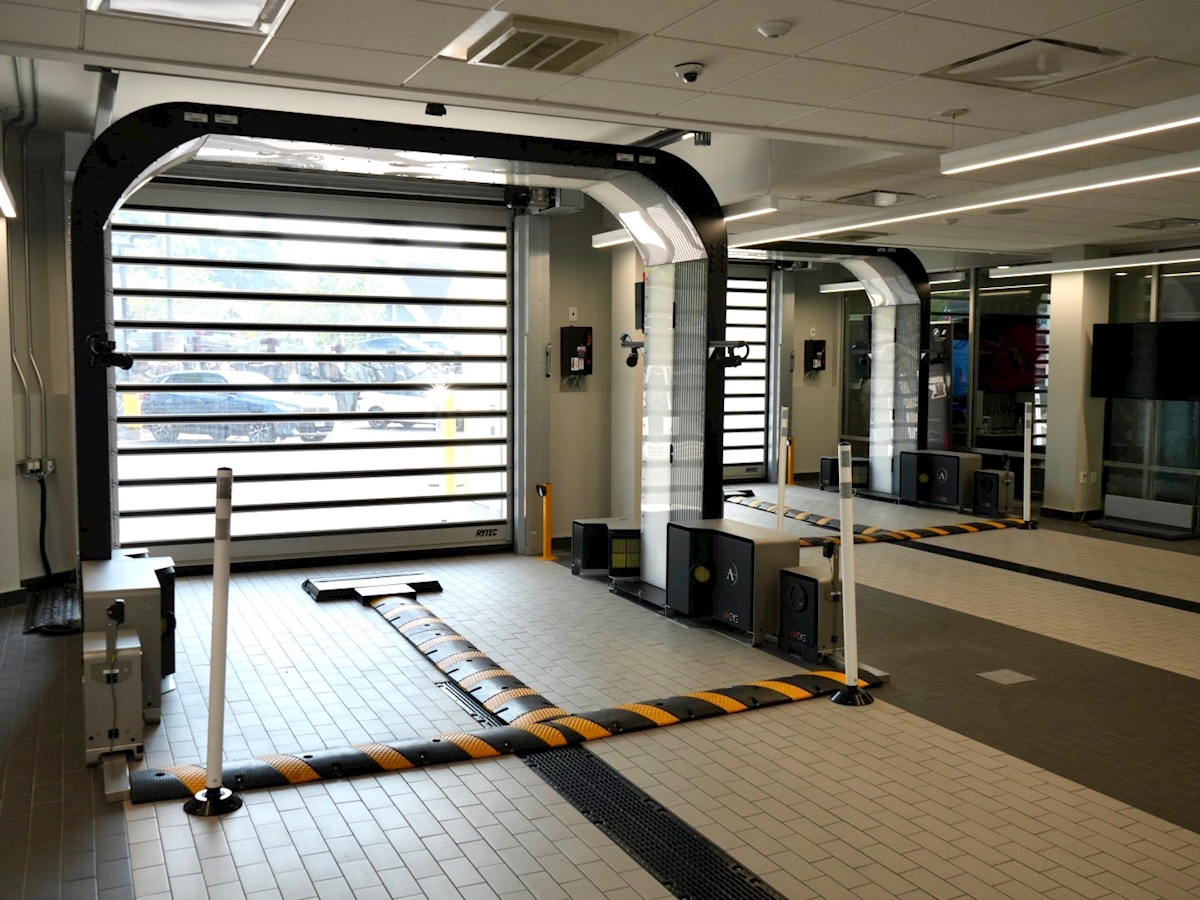 UVeye AI vehicle inspection scanner arches in the drive-through service lane at BMW of Darien in Darien, CT