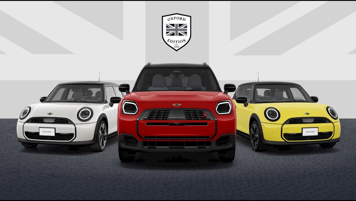 MINI Oxford Edition lineup at MINI of Darien: a Chili Red MINI Countryman S ALL4 flanked by two MINI Cooper models on a Union Jack backdrop